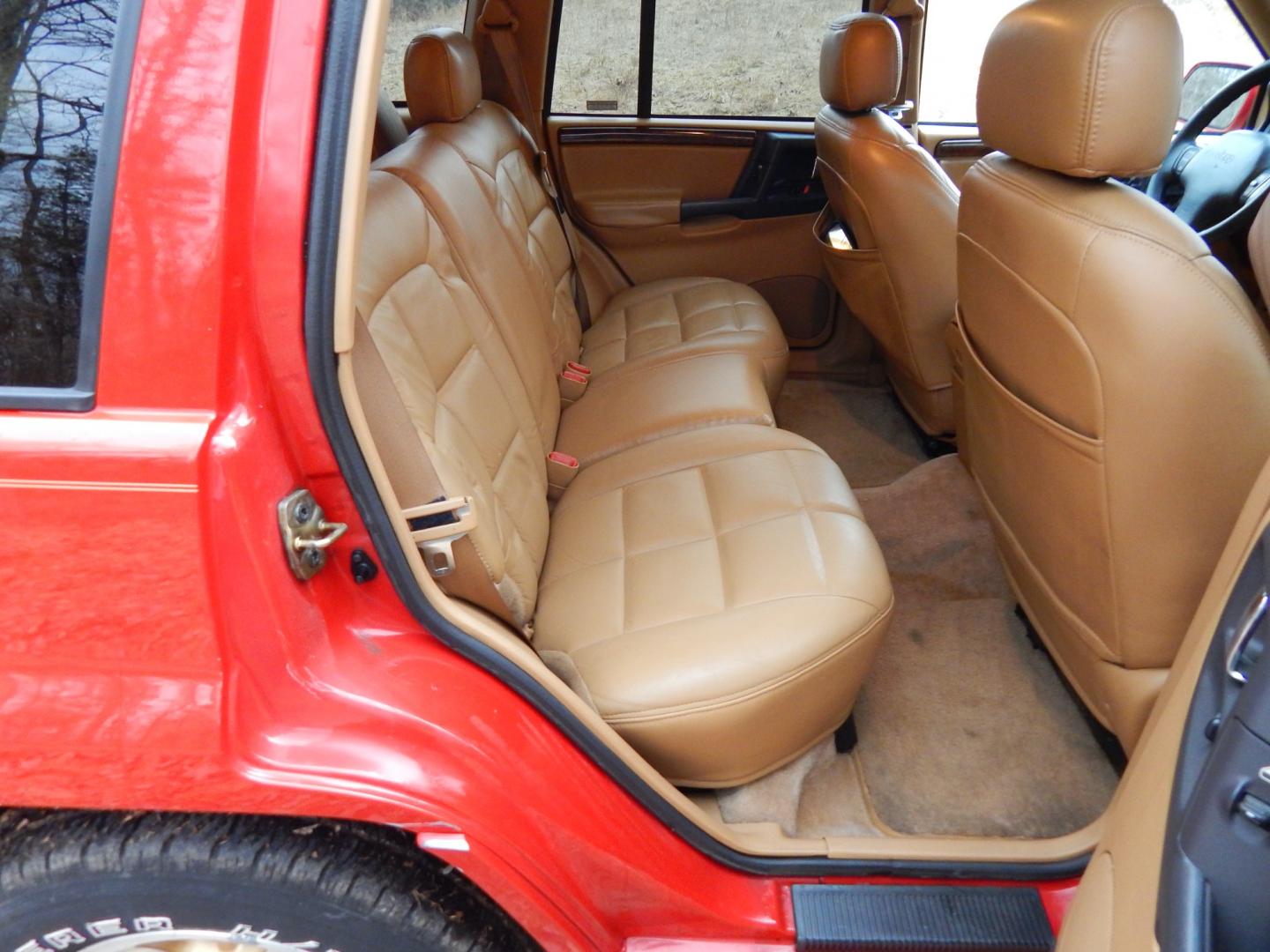 1996 RED /Tan Leather Jeep Grand Cherokee Limited 4WD (1J4GZ78Y6TC) with an 5.2L V8 OHV 16V engine, 4-Speed Automatic Overdrive transmission, located at 6528 Lower York Road, New Hope, PA, 18938, (215) 862-9555, 40.358707, -74.977882 - Here we have a 1996 Jeep Grand Cherokee with a 5.2L V8 putting power to a 4x4 automatic transmission. Options include: tan leather with wood trim, heat/AC, AM/FM/CD/TAPE radio, tilt steering wheel, cruise control, heated front seat, moon roof, power windows/locks/mirrors, roof rack, fog lights, tow - Photo#14